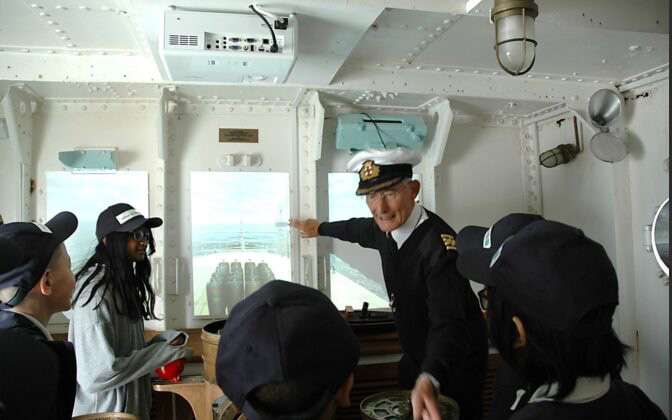 Captain talking to school children
