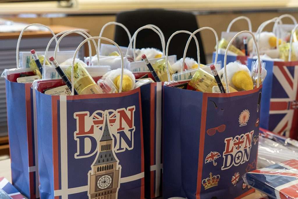 London-themed goodie bags with Union Jack and Big Ben designs, filled with treats for VE Day events aboard HMS Wellington